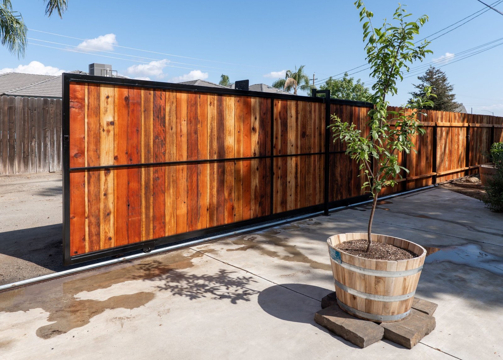 Custom wood and steel driveway gate in Bakersfield
